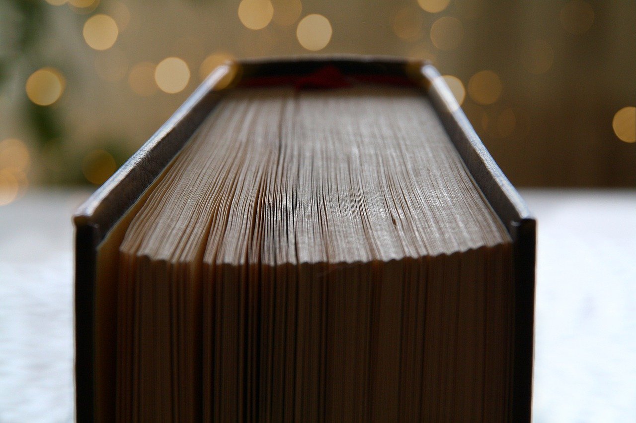 looking down at the top of the pages of a large book